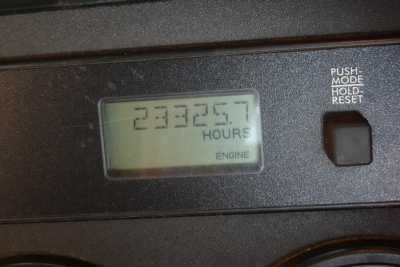 Panel display showing hours engine reading 23325.7 with label ENGINE and push mode/hold/reset button nearby.
