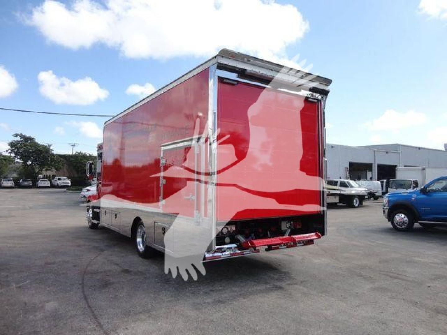 New 2027 Mack MD6 rollback truck in red, rear view showing cargo box and rear bumper.