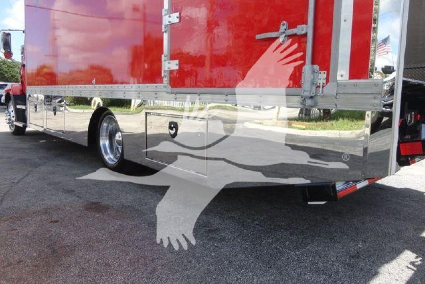 MD6 rollback truck body with glossy chrome lower panel and red cargo area, rear view showing dual rear wheels and bumper, stock MD6TOWBOX1.