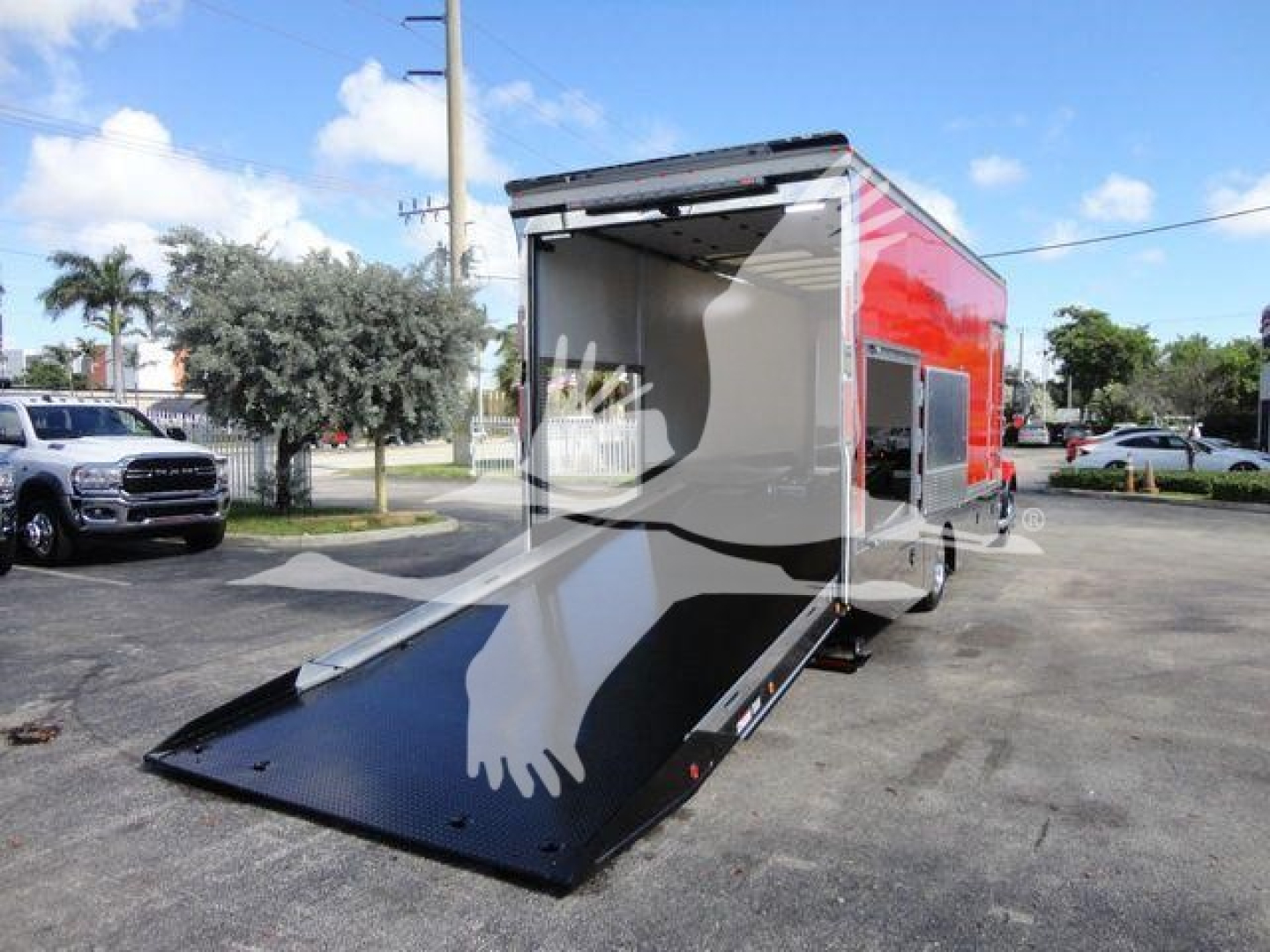 MD6 rollback truck trailer with open rear ramp door showing interior cargo space and red exterior.