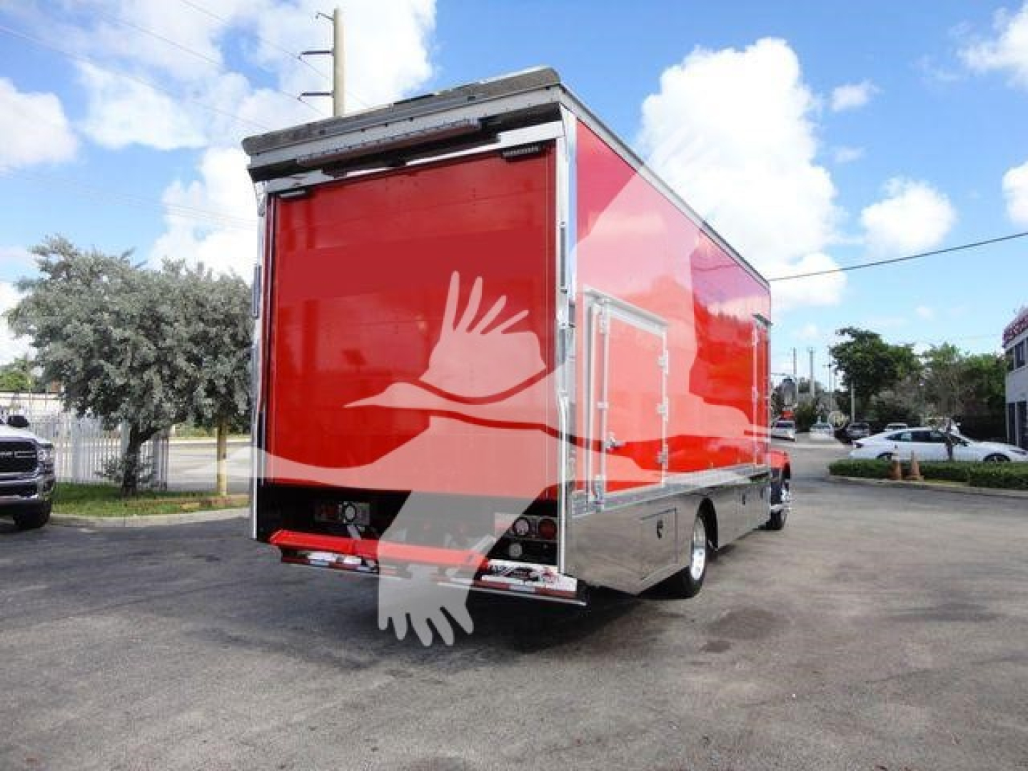 MD6 rollback truck rear view showing red cargo box and chrome trim.