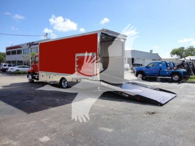MD6 rollback truck with red cargo box and hydraulic loading ramp. Side shows no legible text.