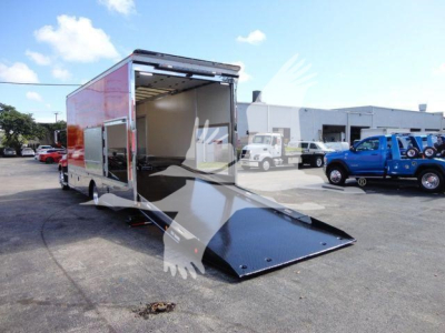 MD6 rollback trailer with open rear ramp door showing empty interior and loading ramp extended.