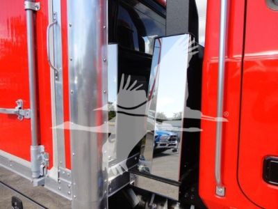 Truck cab interior showing a door mirror, red exterior, chrome hinges, and reflective side panel in the MD6 rollback truck.