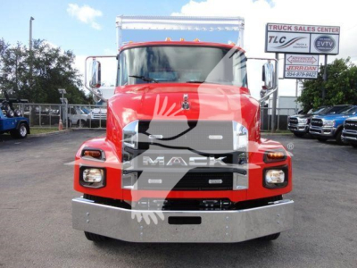 Mack MD6 hood and front grille with red cab and chrome bumper; showroom lot in background.