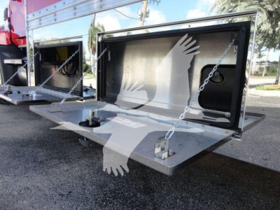 Mack MD6 rollback truck tailgate area showing hydraulic lift platform and storage compartments in a new condition.