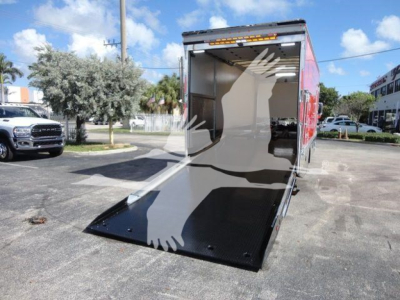 MD6 rollback truck showing open cargo area with ramp deployed and interior walls visible.