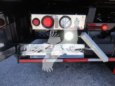 MD6 rollback truck rear showing dashboard with round taillights and control panel, metal step, and bumper.