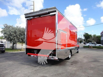 MD6 rollback truck rear view showing red cargo box and chrome trim.