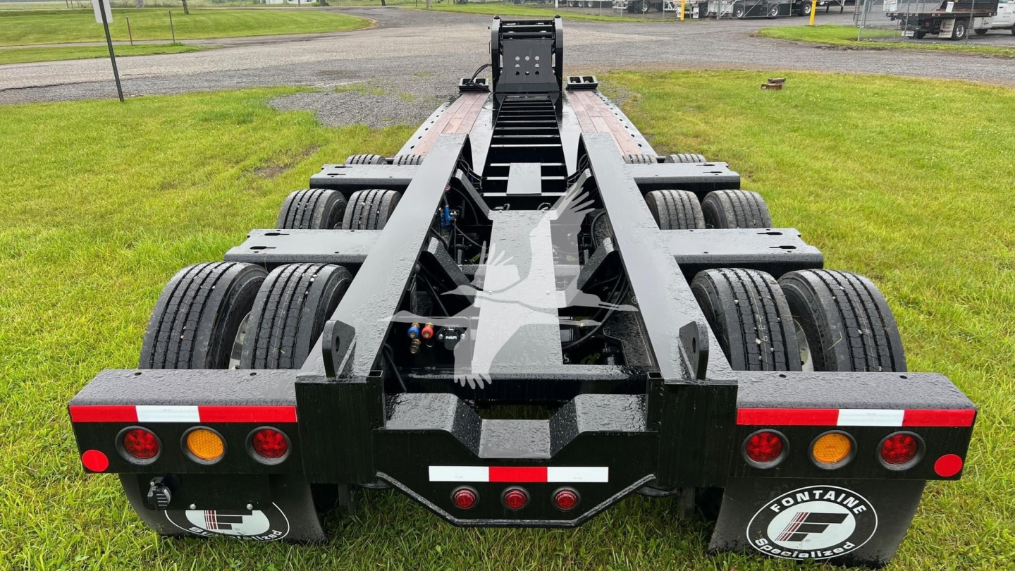 Trailer chassis showing重 dual-axle rear with multiple wheels and mounting frame for Fontaine 55 LCC lowboy trailer, rear view
