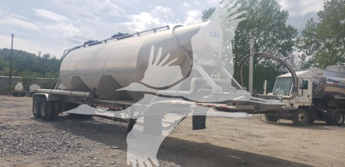 Tank trailer for pneumatic dry bulk transport with a white cylindrical tank on a dual-axle trailer and a separate truck tractor; shows logo watermark on image.