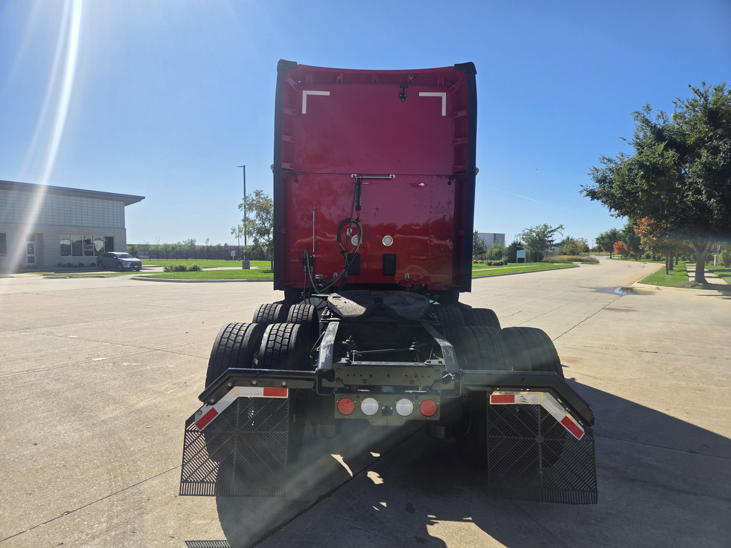 Kenworth T680 tractor rear view showing fifth wheel and dual rear axles.