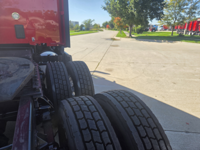 Kenworth T680 truck rear wheels and chassis showing dual tires and frame.