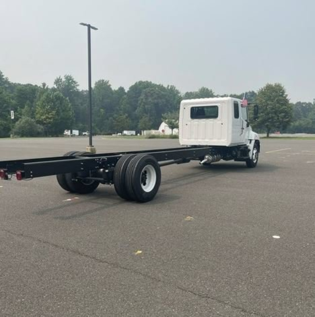 Truck chassis with long rear frame and cab, rear axle and dual tires, white cab, 5PVNJ7EY7V5T50276 visible VIN.