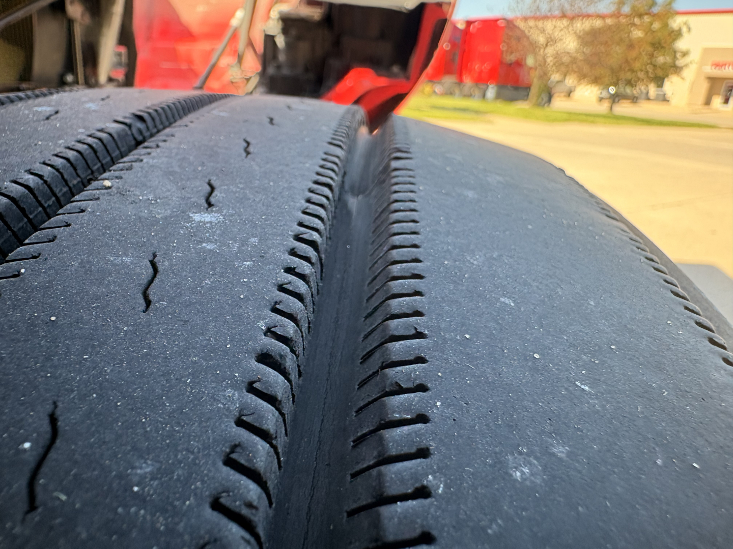 Tires on a 2023 Kenworth T680 truck showing tread pattern and surface details.