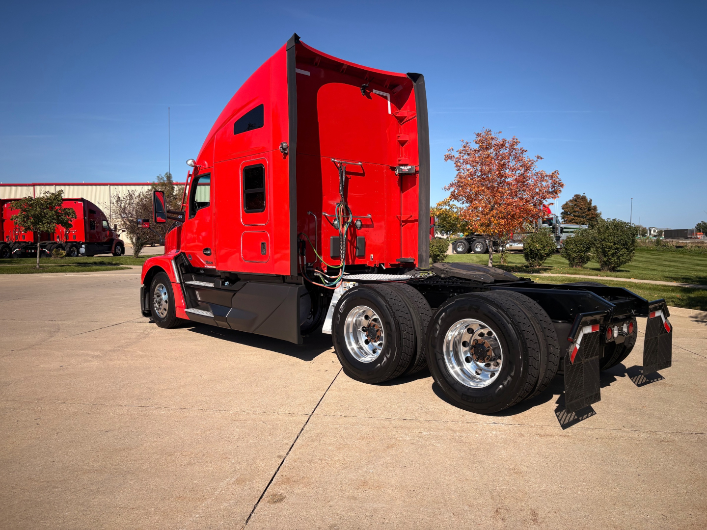 Kenworth T680 tractor unit in red with sleeper cab, side view showing rear wheels and chassis, stock number 0633363.