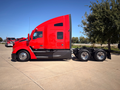 Kenworth T680 tractor in red with sleeper cab, side profile showing 6-wheel rear, wheels and chassis visible.