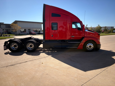 Kenworth T680 tractor side view showing red sleeper cab and dual rear axles with wheels, VIN 1XKYD49X6PJ230259 and stock 0633363 not visible in image