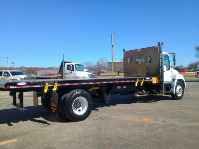 Flatbed truck showing 2025 Hino L7 with low-profile flatbed and wheelbase, VIN 5PVNV7AT7S5T50417 visible on listing, stock 66825.