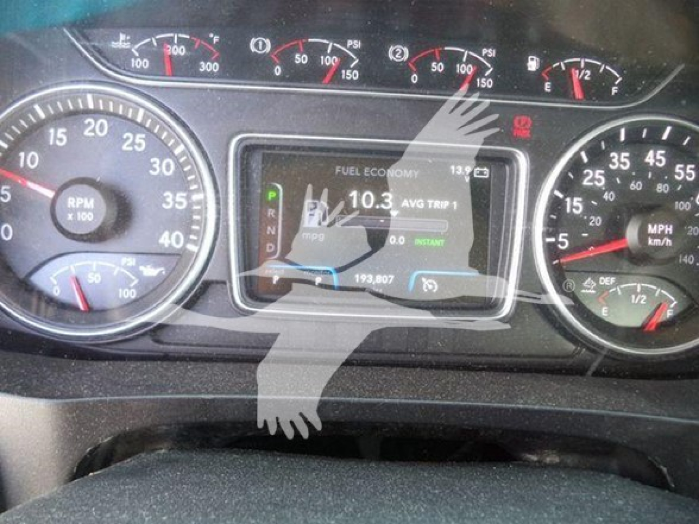 Dashboard of 2020 International MV showing RPM gauge, speedometer, digital display with fuel economy and trip data.