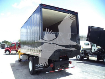 Back view of a 2020 International MV truck with a large container box, visible wheelset, and rear lights.