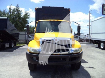 Truck front view of a yellow 2020 International MV cab over engine with black grille and large windshield.