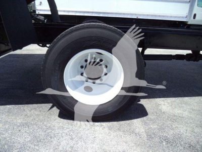 Truck wheel and tire assembly on a 2020 International MV chassis showing white steel wheel and tire with tread visible
