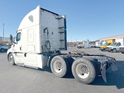 Freightliner Cascadia 126 sleeper tractor side view showing rear trailer hitch area and dual rear axles. No visible model text on cab.