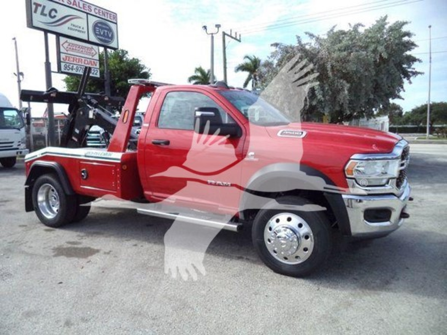 Red Ram 4500 tow truck with winch, side view showing dual rear wheels and chrome rims.