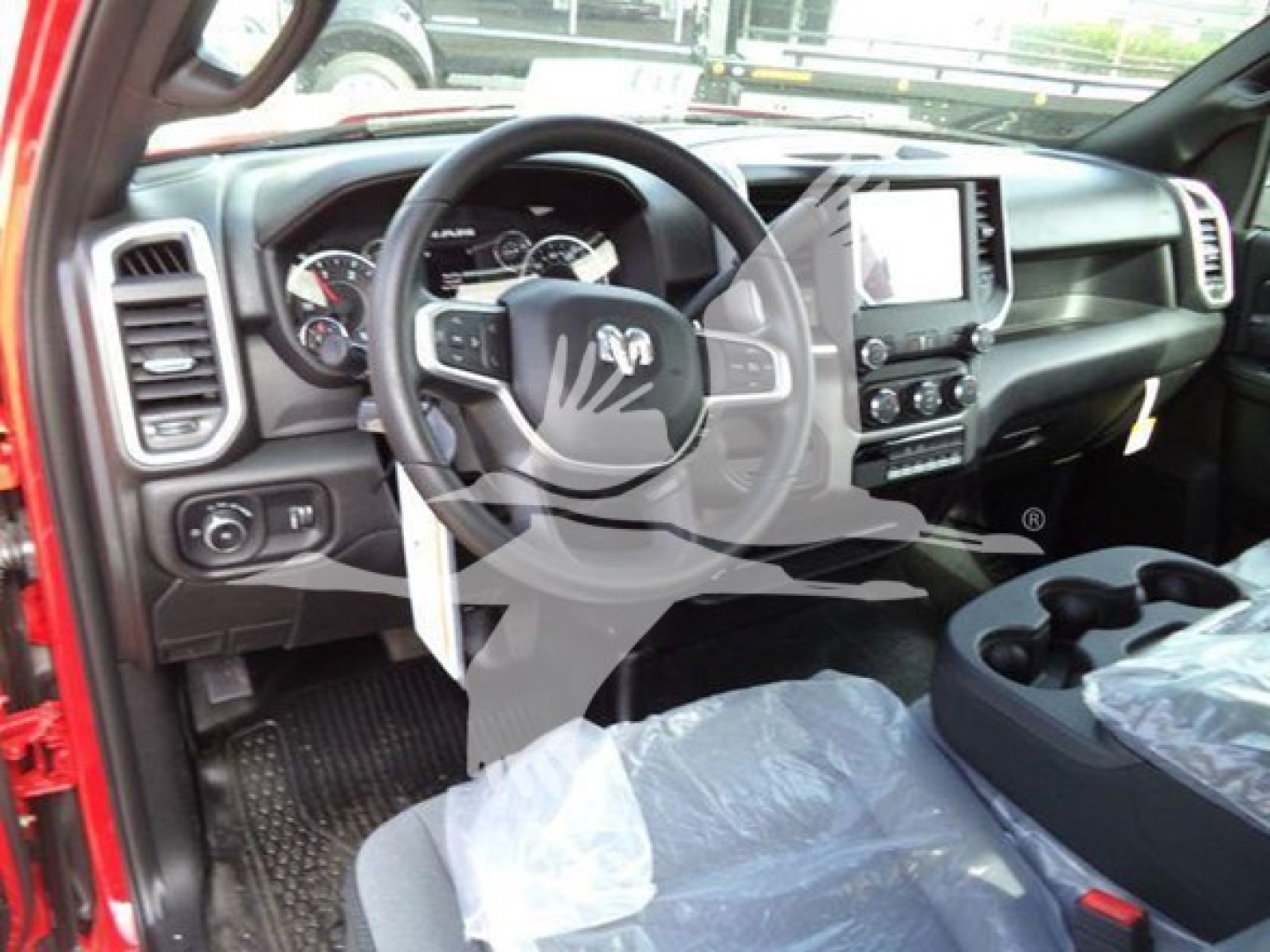 Ram 4500 interior view showing steering wheel, dashboard, and center touchscreen display.