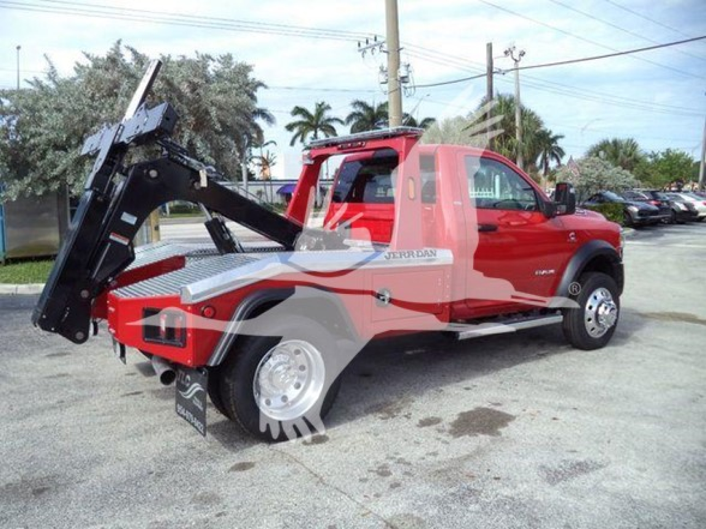 Ram 4500 truck with winch attachment in red and black, side view, J64735 stock number visible
