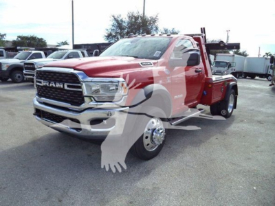 Ram 4500 SLT tow truck in showroom red with chrome grille front view; Silverado-style ram badge with winch category; VIN 3C7WRKAL9RG164735