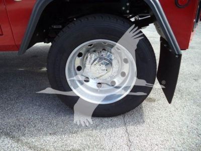 Wheel and tire of a Ram 4500 truck with chrome hubcap; partial fender and mud flap visible.
