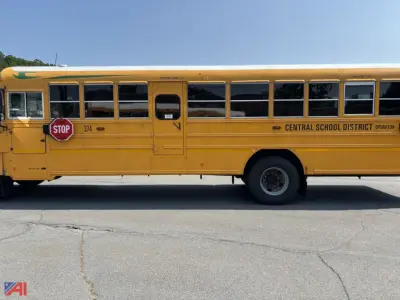 Bus side view showing school bus with yellow body, Central School District branding, stop sign, and windowed seating area.