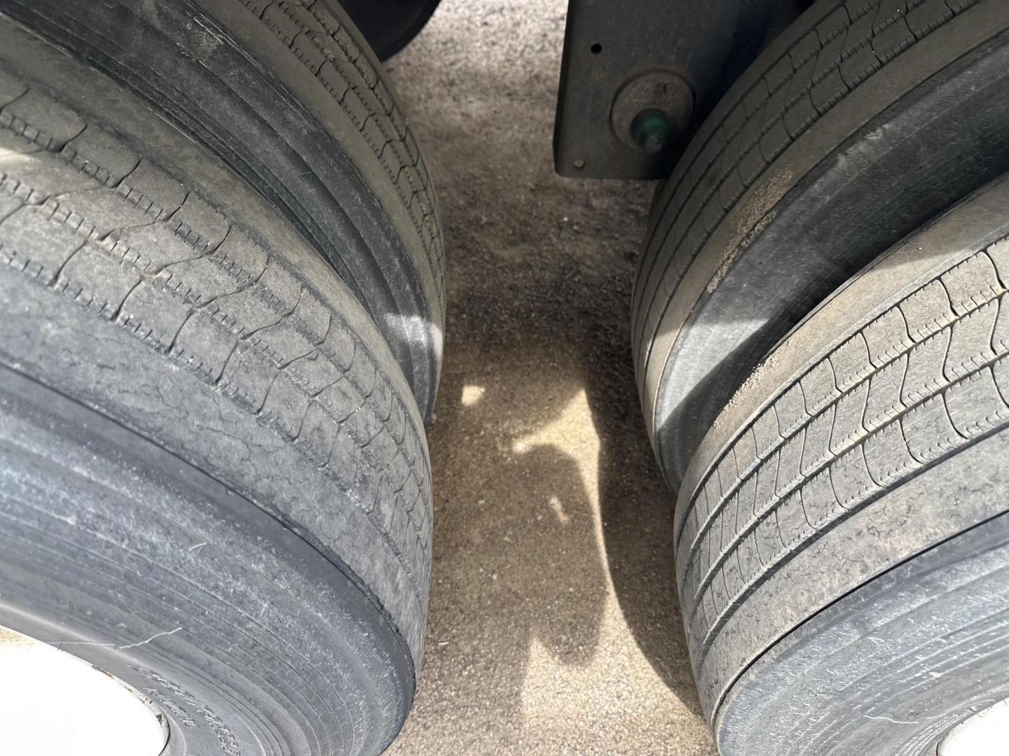 Trailer tires on a 2016 Utility 4000D-X trailer with dual axles and tread details visible.