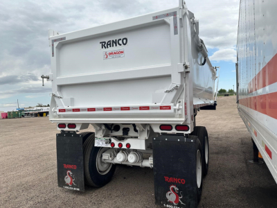 Ranco dump trailer rear view showing rear doors and axle, with RANCO branding and Dragon logo on the tailgate.