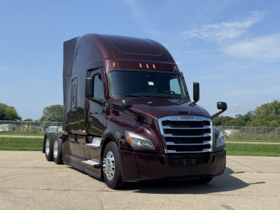 Truck engine bay not visible; image shows a maroon 2022 Freightliner Cascadia 126 sleeper cab from front-left angle.