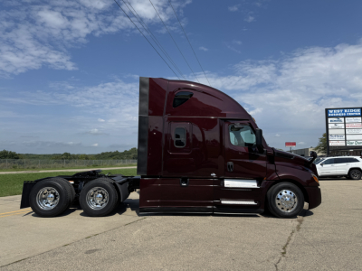 Tractor-trailer truck cab in side profile showing Freightliner Cascadia 126 with maroon paint and sleeper cab.