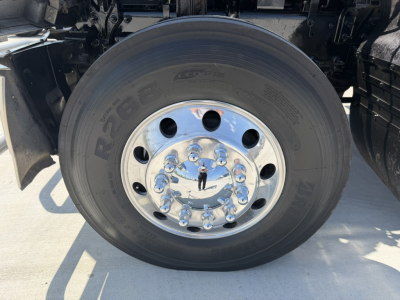 Wheel and tire assembly of a 2020 Mack PI64T truck showing chrome hub with lug nuts and tire. Visible text on tire: N/A.