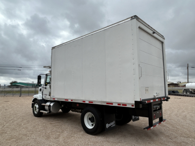 Truck box rear and side view showing refrigerated box on a Mack MD6 chassis with white cargo box.