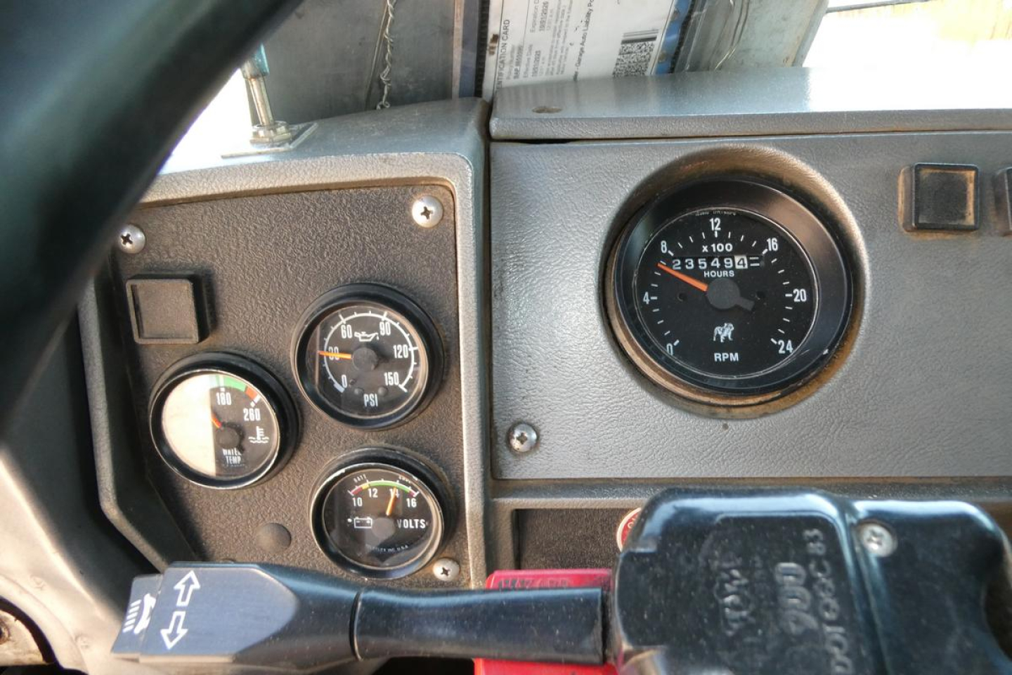 Mack RD688S instrument cluster and dash showing gauges and steering column within cab view.