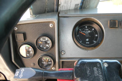 Mack RD688S instrument cluster and dash showing gauges and steering column within cab view.
