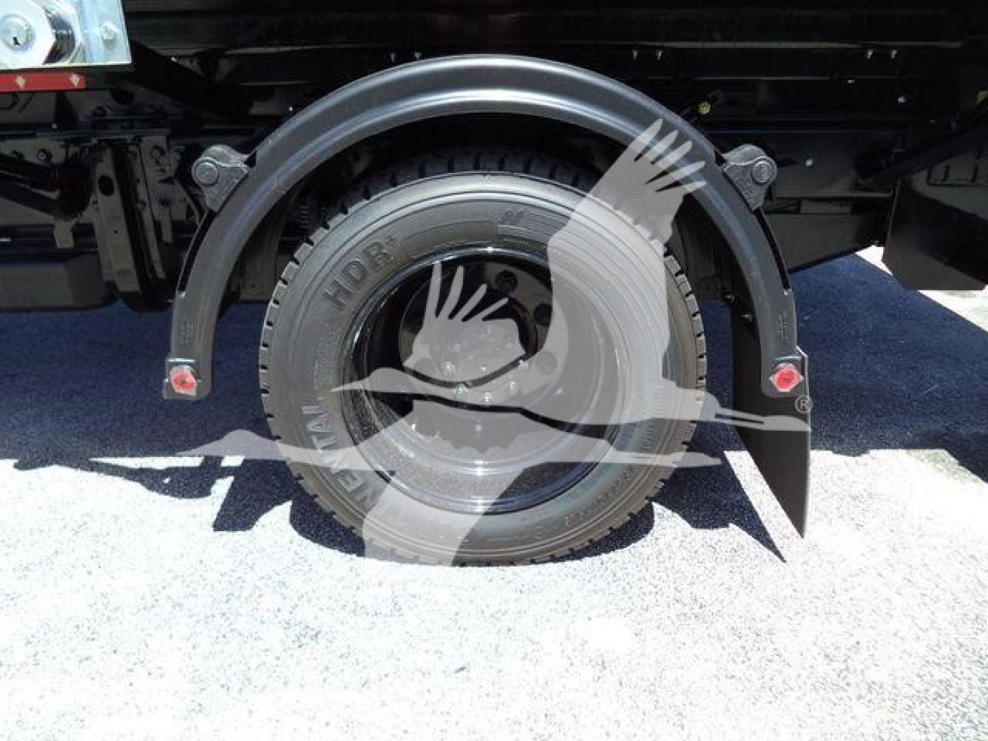 Chevrolet Silverado 6500HD wheel and fender area showing spare wheel and mud flaps