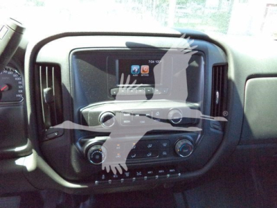 Chevrolet Silverado 6500HD interior dashboard center console with touchscreen display and control knobs.