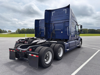 Volvo VNL 760 truck tractor rear view showing sleeper cab and dual rear axles.