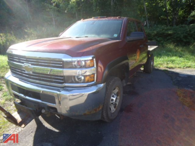 Chevrolet Silverado 2500 pickup truck front-left view showing damaged front bumper and grille with Chevrolet emblem; red body, extended cab, 4x4, used vehicle.