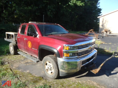 Chevrolet Silverado 2500 pickup truck in red with plow attachment and left-side view, front grille chrome, 4x4 badge obscured, worn bed area, VIN not visible.