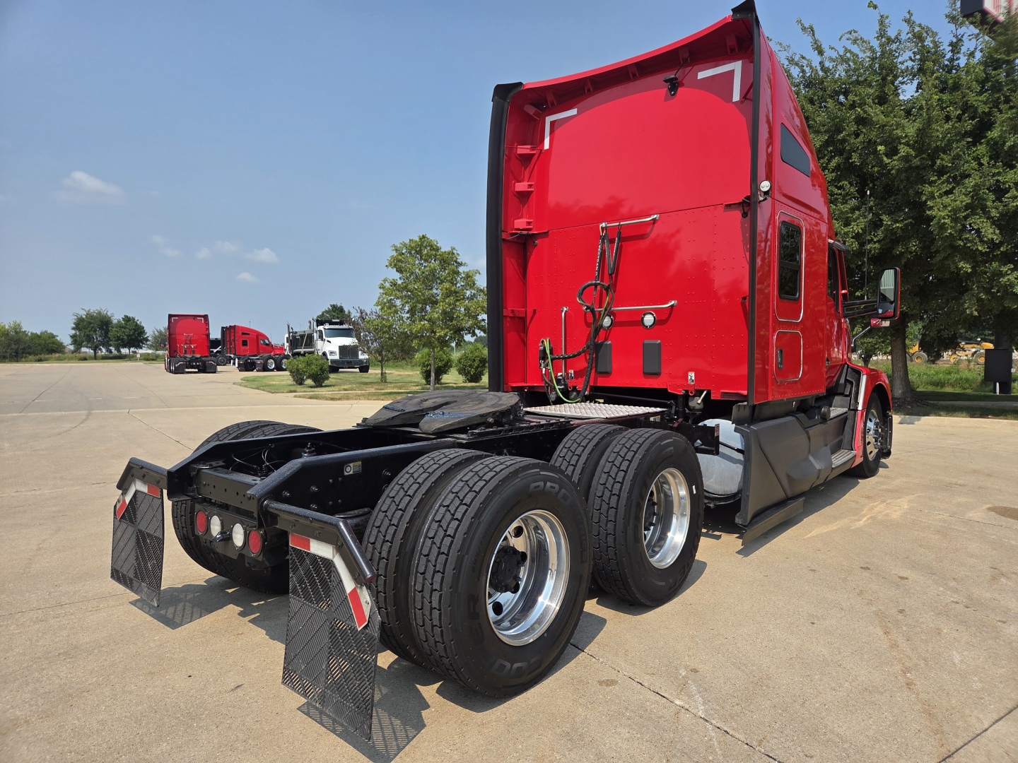 Kenworth T680 tractor cab rear and dual rear axles showing chassis and fifth wheel, red sleeper cab, stock number 0628012