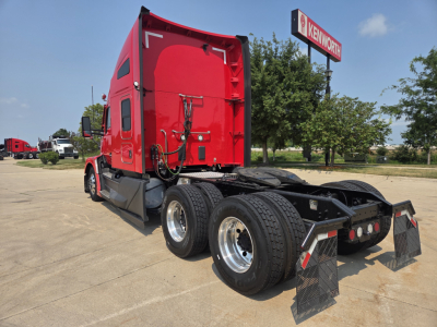 Kenworth T680 sleeper cab rear view showing dual rear axles and mud flaps