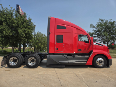 Kenworth T680 conventional sleeper truck side view showing red cab with aerodynamic lines and dual rear axles.